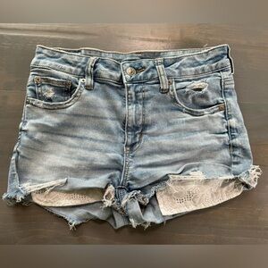 America Eagle Women’s Demin Frayed Jean Shorts with Lace Pockets. Size 4.